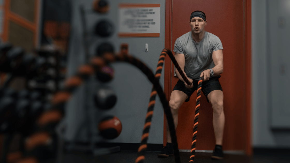 man battle rope in gym