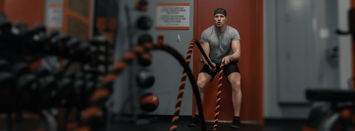 man battle rope in gym